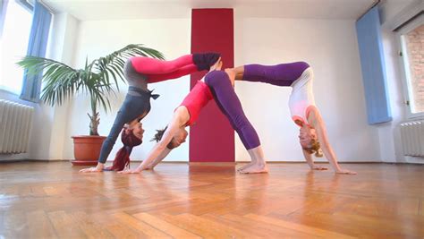 Three Women Doing Acrobatic Yoga In Hall Stock Footage Video 5592629
