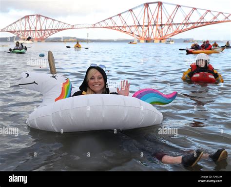 People Take Part In The Annual Loony Dook Swim In Firth Of Forth