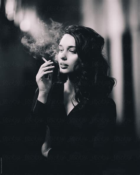 Beautiful Woman Posing With A Cigarette By Stocksy Contributor