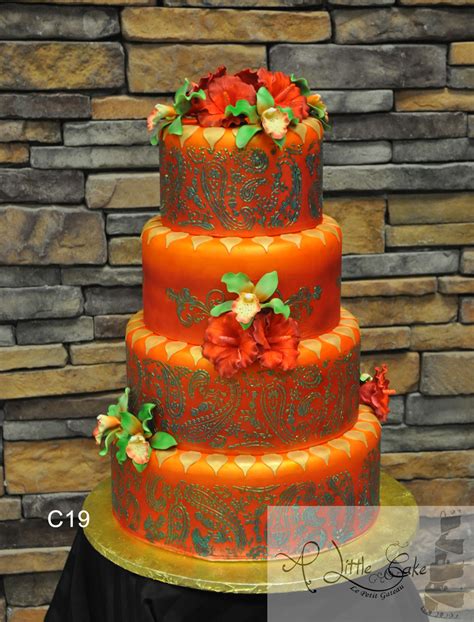 C19 Flowered Fondant Wedding Cake With Vibrant Orange And Green Design