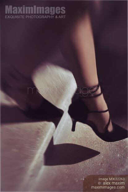 Photo Of Closeup Of Woman Legs In Black High Heel Shoes Walking Down