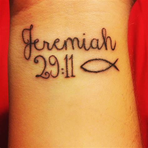 A Wrist Tattoo With The Word Fereniah Written In Cursive Writing