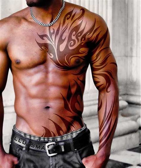 Amazing Tribal Arm And Chest Tattoo For Men