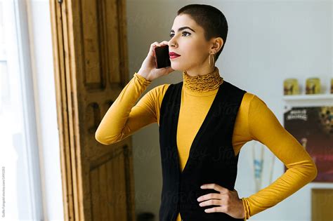 Elegant Woman With Short Hair Making Phone Call By Stocksy Contributor Guille Faingold Stocksy