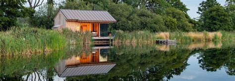 Tiny Homes This Timber Clad Cabin Appears To Hover Over An Idyllic Lake