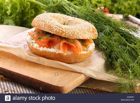 Sandwich With Smoked Salmon And Dill On A Chopping Board Stock Photo