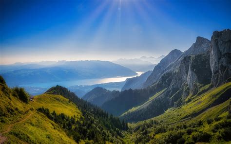 2048x1280 Switzerland Sky Lake Mountains Coolwallpapersme