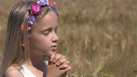 Little Girl Praying Child With Eyes Closed Saying Prayer Pensive Kid