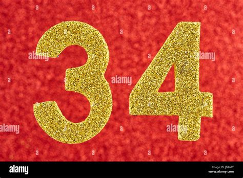 Number Thirty Four Yellow Color Over A Red Background Anniversary
