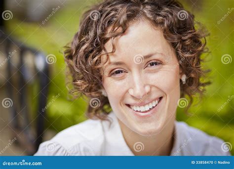 Portrait Of A Beautiful Woman Smiling At The Camera Stock Photo Image