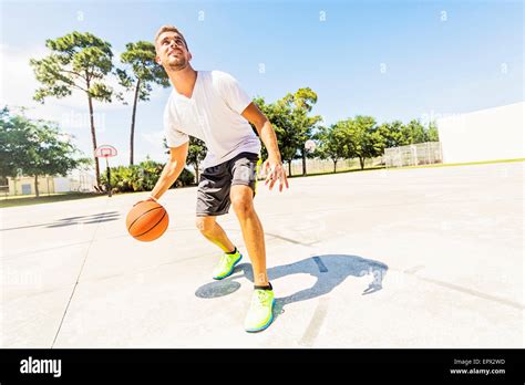 Young Man Dribbling Basketball Stock Photo Alamy
