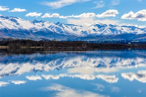 Reflection Of Snowy Mountains Near Fairlie New Zealand Stock Photo
