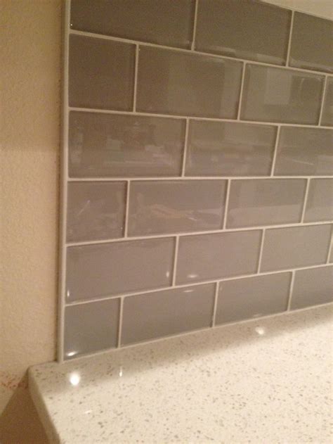 Maybe you would like to learn more about one of these? Smoke Glass Backsplash with Metal Edging | Metallic ...