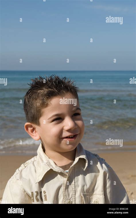 Happy Young Boy By The Sea Stock Photo Alamy