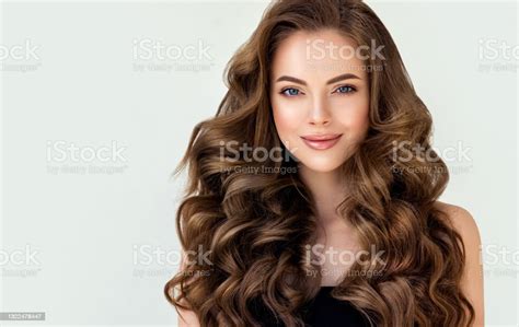 Beautiful Looking Model With Long Dense Curly Hairstyle And Vivid