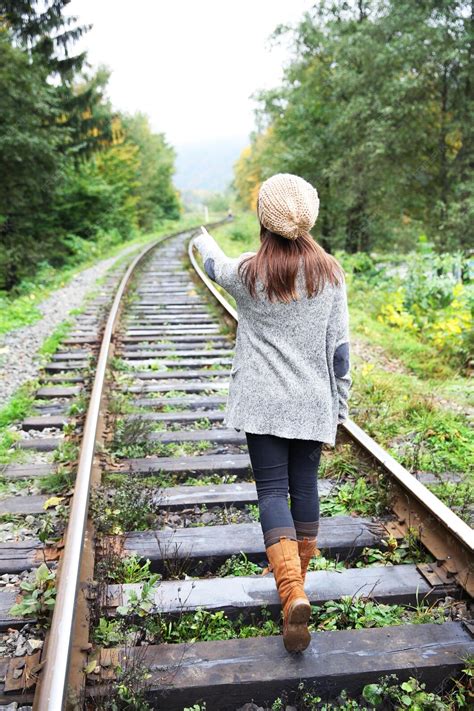 Premium Photo Young Woman Walking On Rail Of Railway Tracks