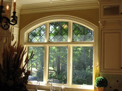 Triple Window With Decorative Black Diamond Grid In The Arched Top
