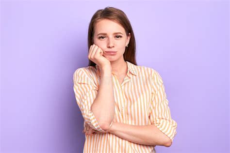 Bored Pretty Girl Holding Hand Under Chin Tired To Wait For Something For So Long Stock Image