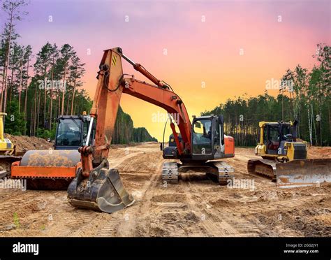 Bulldozer Excavator And Soil Compactor On Road Work Earth Moving