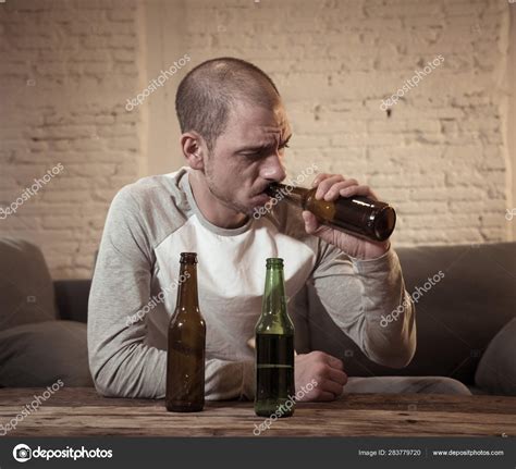Young Sad Drunk Men Drinking Beer Alcohol Feeling Wasted Lonely Stock