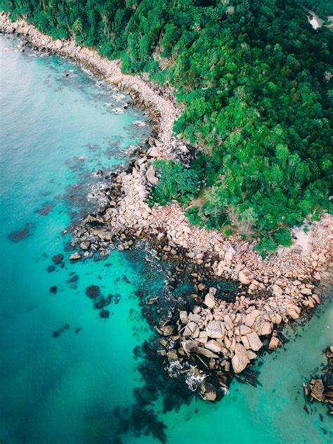 Tropical Coastline With Rocks And Turquoise Sea · Free Stock Photo