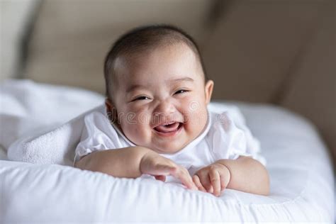 Adorable Asian Baby Girl Lying On Bed Looking At Cameracute Little