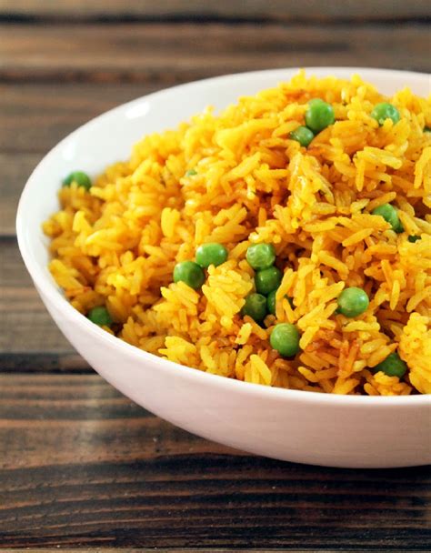 2 cup basmati rice or rice of your choice 4 cups chicken broth or water 1 tbsp unsalted butter 1/2 tsp salt red and green peppers( minced) 1/2 of a medium onion( minced) 2 tsp tumeric tumeric is good for your digestive system and good for your body overall directions: Yellow Rice with Sweet Peas - Not Quite a Vegan