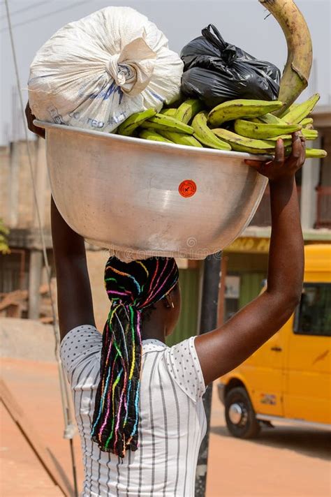 unidentified ghanaian woman carries a basin on her head in loca editorial photography image of
