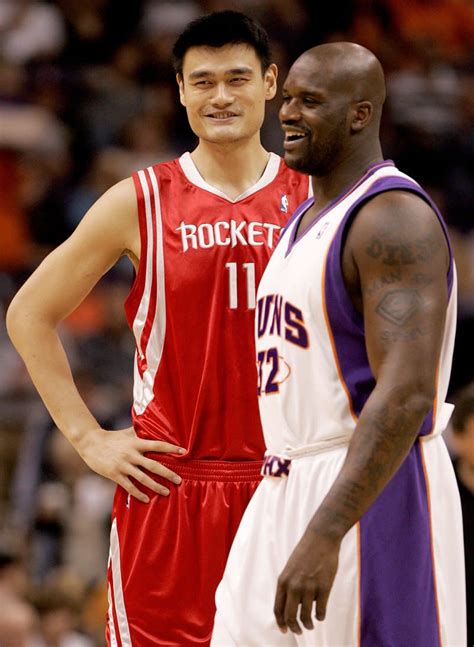 photo of yao ming making shaq look short really puts yao ming s height in perspective