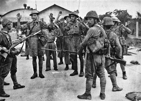 british soldiers surrender to the japanese army during the battle of singapore february 1942
