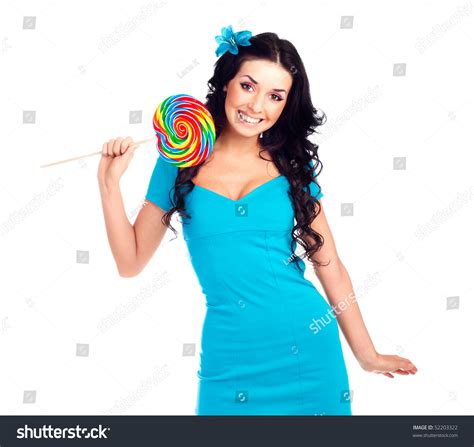 Pretty Smiling Brunette Girl With A Lollipop In Her Hand Stock Photo