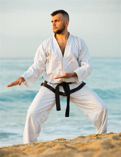 Male Is Exercising To Doing The Kokutsu Dachi Stance Stock Image