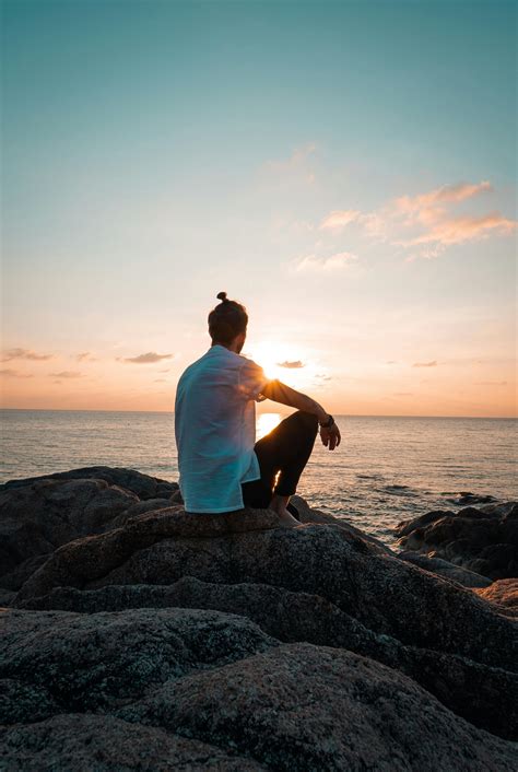 Man Sitting On A Rock · Free Stock Photo