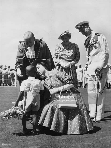 Celebrate the fact that they can now legally drink with a unique gift honoring the occasion. Princess Elizabeth crouches down to receive a bouquet from ...