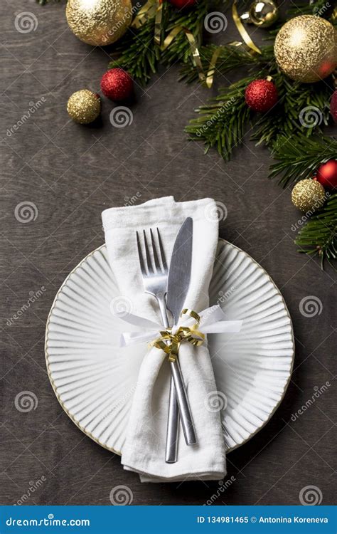 Christmas Table Setting With Fork And Knife And Christmas Decorations