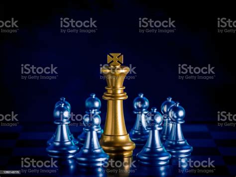 Golden King Chess Is Surrounded By Falling Around Silver Chess Pieces