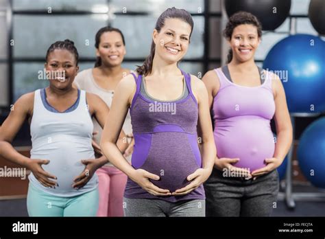 Smiling Pregnant Women Touching Their Belly Stock Photo Alamy