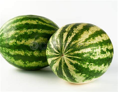Big Green Striped Whole Watermelon On A Yellow Background Stock Photo