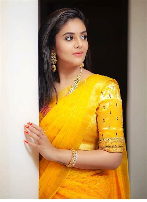 telugu television actress sreemukhi in indian traditional yellow lehenga choli sreemukhi navel