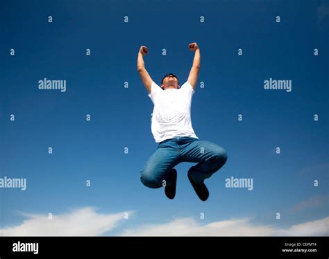 Man Jump In The Blue Sky Stock Photo Alamy