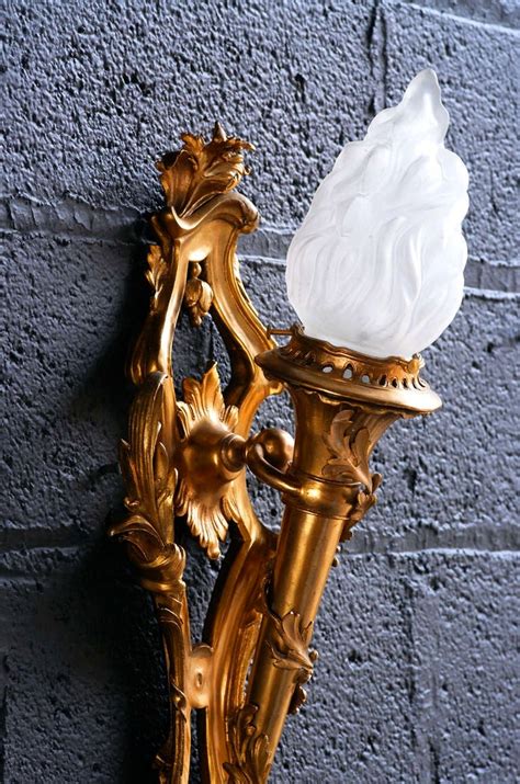 Flaming Bronze Torch Sconces At 1stdibs