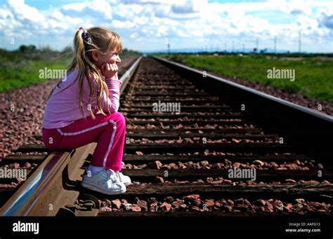 Young Girl Laying On A Railway Against Summer Landscape Hoodoo Wallpaper