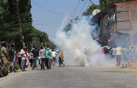 J K Police Use Batons Tear Gas To Quell Protests Over Killing Of