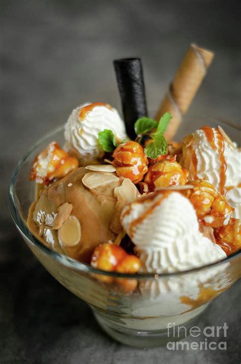 caramel and almond ice cream sundae dessert in glass bowl photograph by jm travel photography