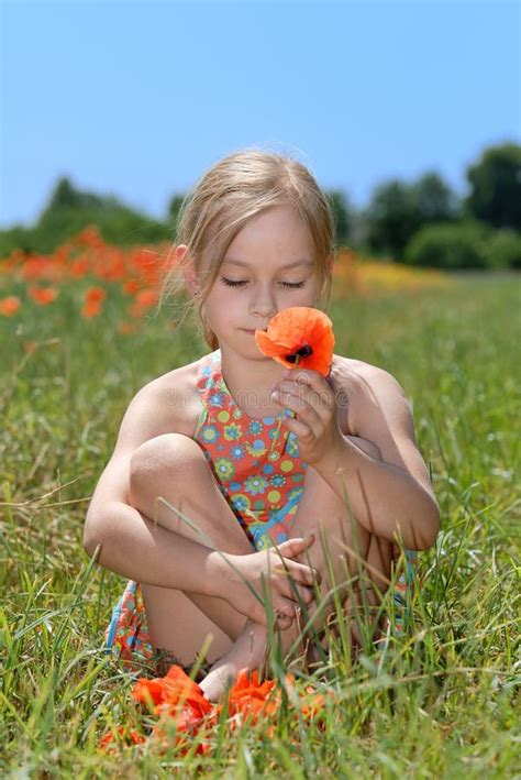 Little Girl In A Colorful Dress On Green Field Stock Image Image Of