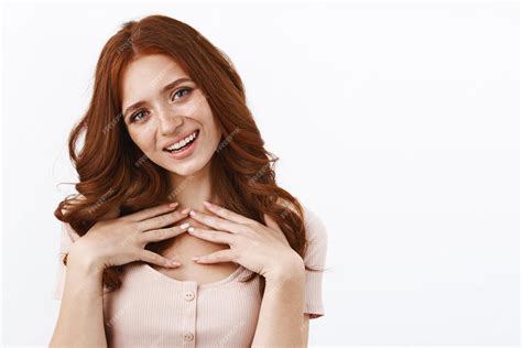 Free Photo Touched Cute Coquettish Redhead Girl In Blouse Touching Chest Grateful And Pleased