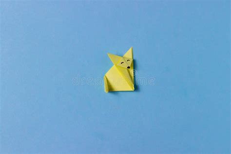 An Origami Fox Is Folded From Yellow Paper In The Technique Of Origami