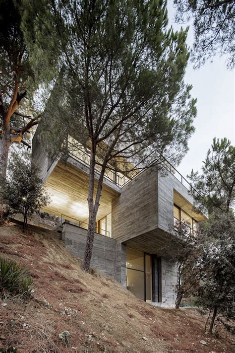 The home's design is partly dictated by the inclusion of overhanging roofs that slope downwards, limiting the amount of sunlight during the. Steep Slope House design goes vertical, just like trees