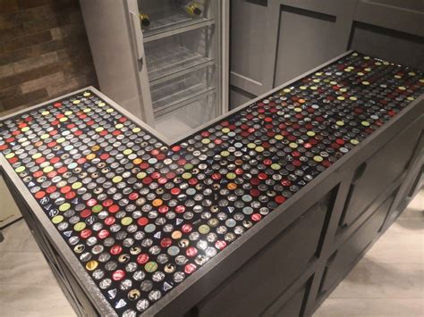 Vector closed blank glass transparent creen bottle of light beer with green label and set of caps side top. epoxy resin bar top with bottle caps. base built out of ...