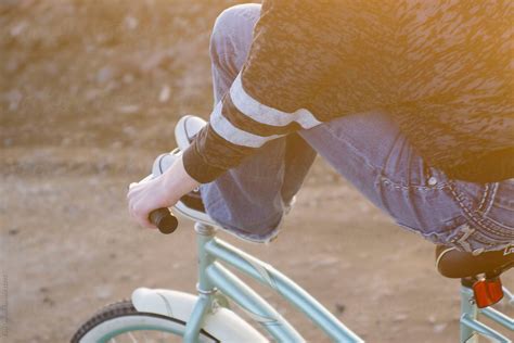 Young Teen Girl With Her Feet Up On Handle Bars Of Bike By Stocksy Contributor Tana Teel